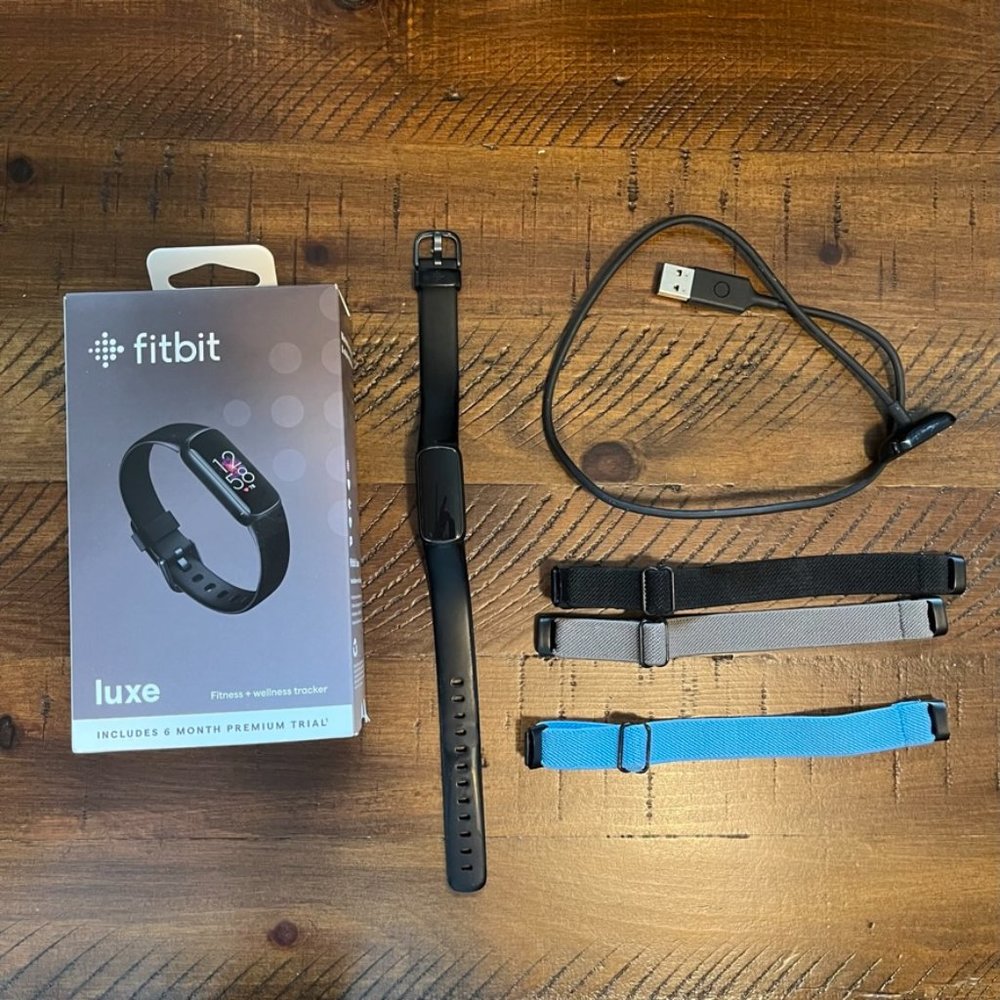 LIKE NEW Black Fit Bit Luxe with charger, 4 bands, screen protectors